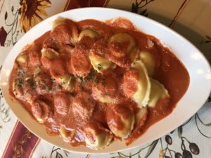 Ravioli with pink sauce